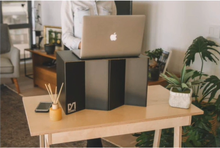 A cardboard standing-desk tool.